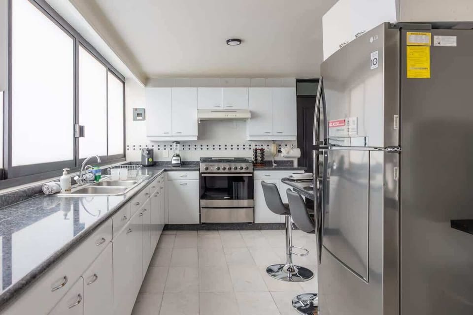 Modern kitchen with a cozy breakfast nook, perfect for casual meals or morning coffee.