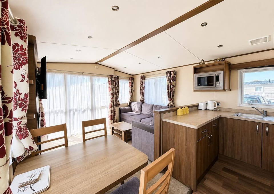 The large sofa is perfect for relaxing with the family and sharing stories from the day. Better still gather everyone around and plan the fun for the rest of your stay. Where will you go next?