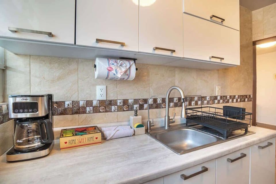 Our clean kitchen sink area, stocked with essentials for your stay.