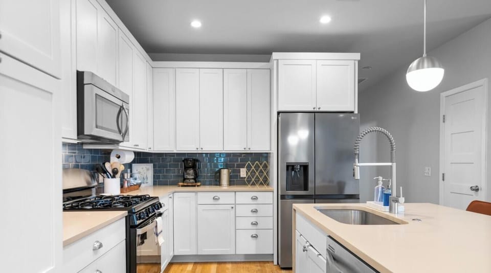 All the essentials are here: French-door fridge, gas stove, dishwasher, coffee maker, and electric kettle.