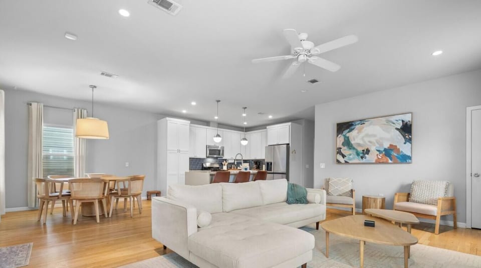 Open sightlines connect the living room, dining area, and kitchen so everyone stays together.