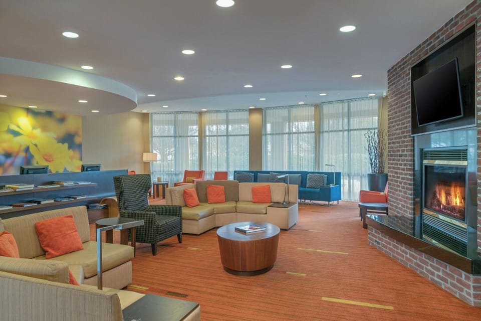 Relax by the glowing fireplace in a spacious, stylish lounge.