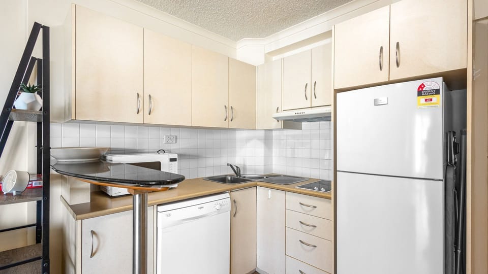Compact, modern kitchen with all essentials for a comfortable stay.