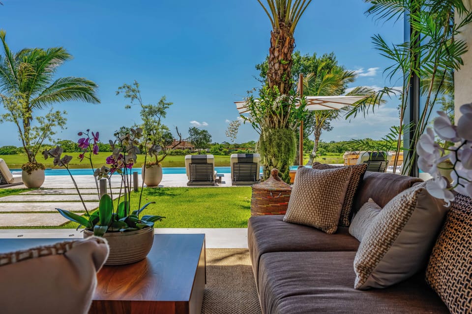 Poolside patio seating gives guests a comfortable spot to unwind between swims