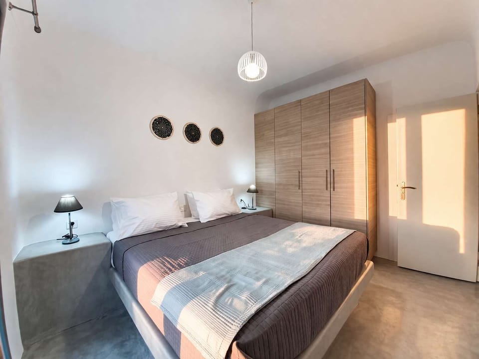 Cozy and welcoming bedroom with soft bedding and warm lighting. Perfect for winding down in the evening and enjoying restful sleep in a peaceful setting