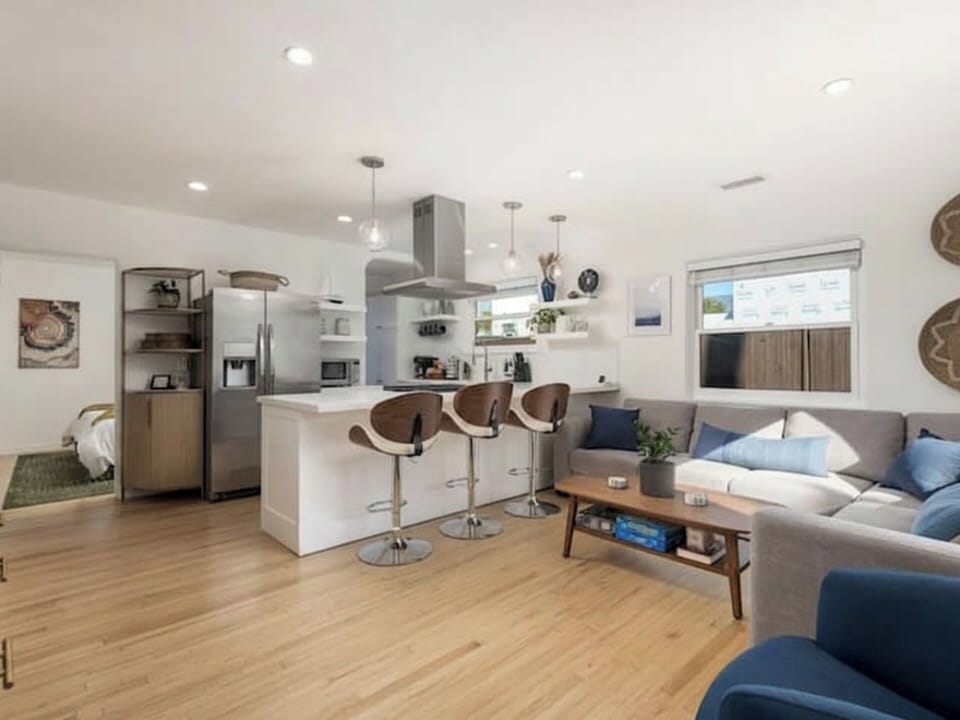 Enjoy a seamless flow between the fully equipped kitchen, dining at the island