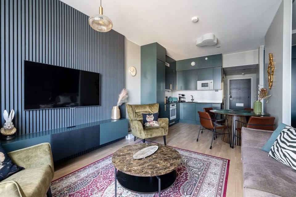 The spacious open-plan layout ensures you can socialize and move freely between the fully equipped kitchen and the entertainment area, making the most of your group stay.