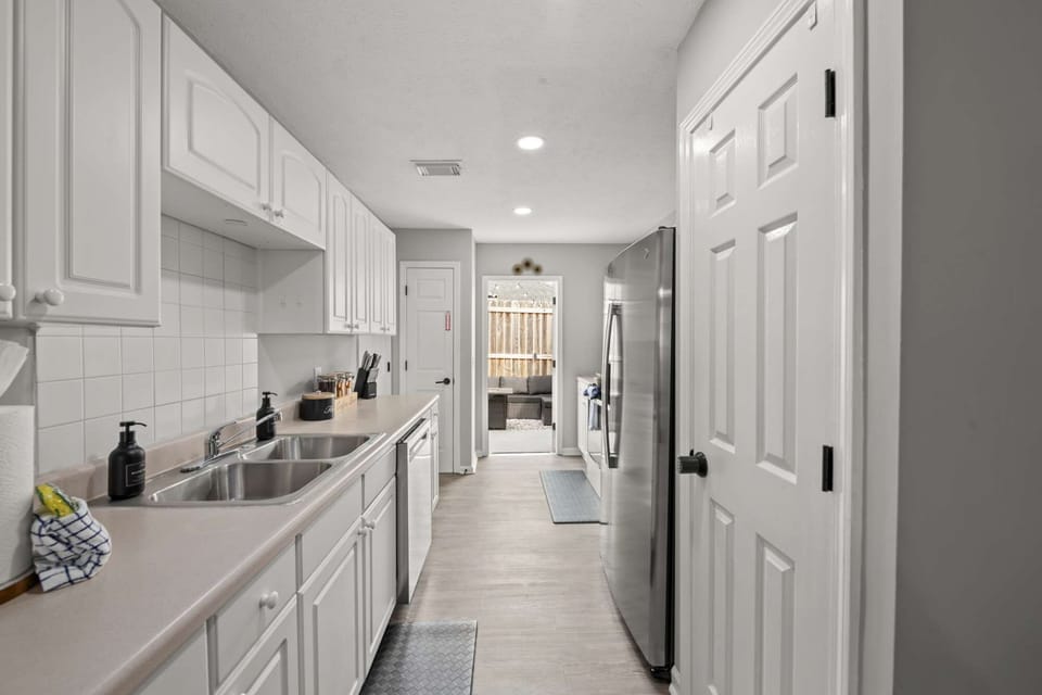 Cook, dine, and unwind in this cozy open-concept kitchen and living area.