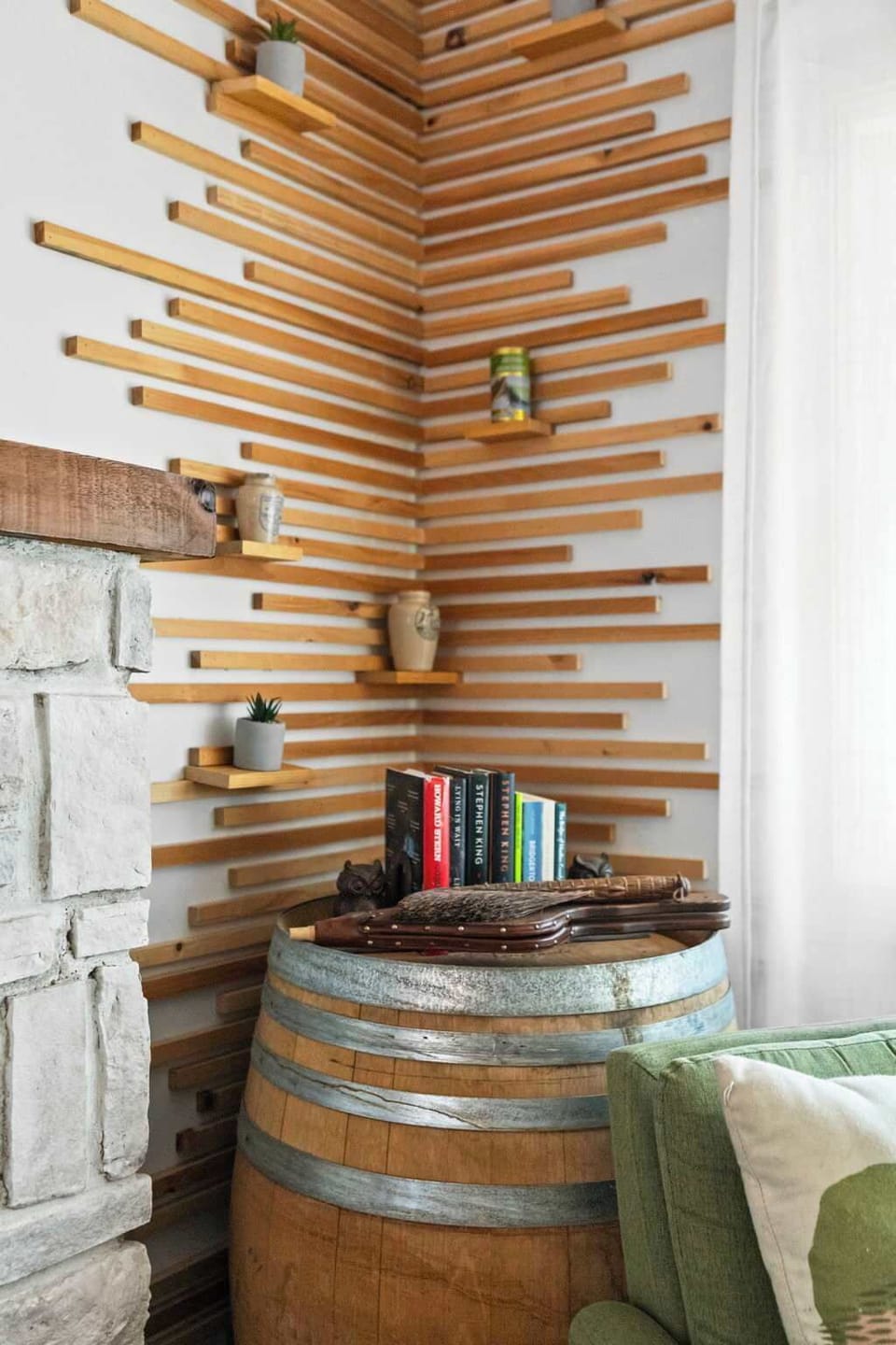 Wood slat accent wall with reclaimed barrel and mood lighting