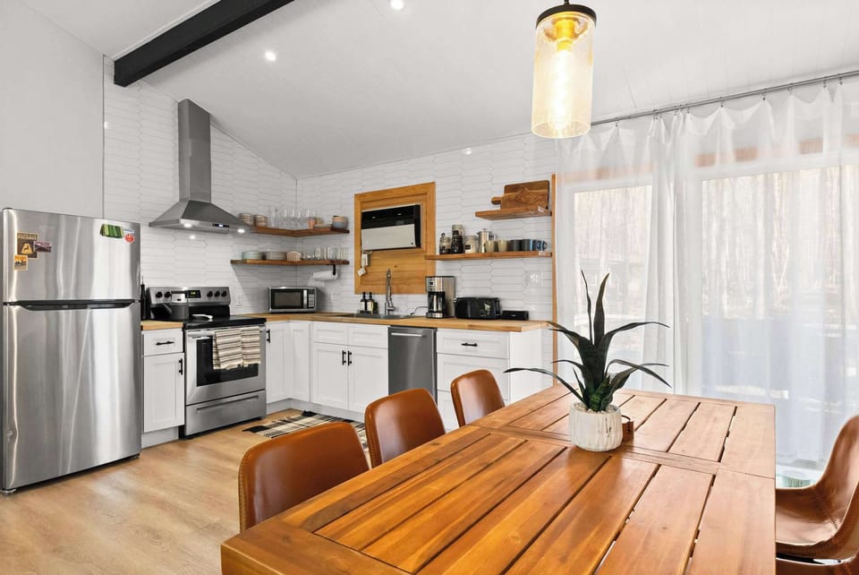 Bright kitchen view from the dining table with open flow