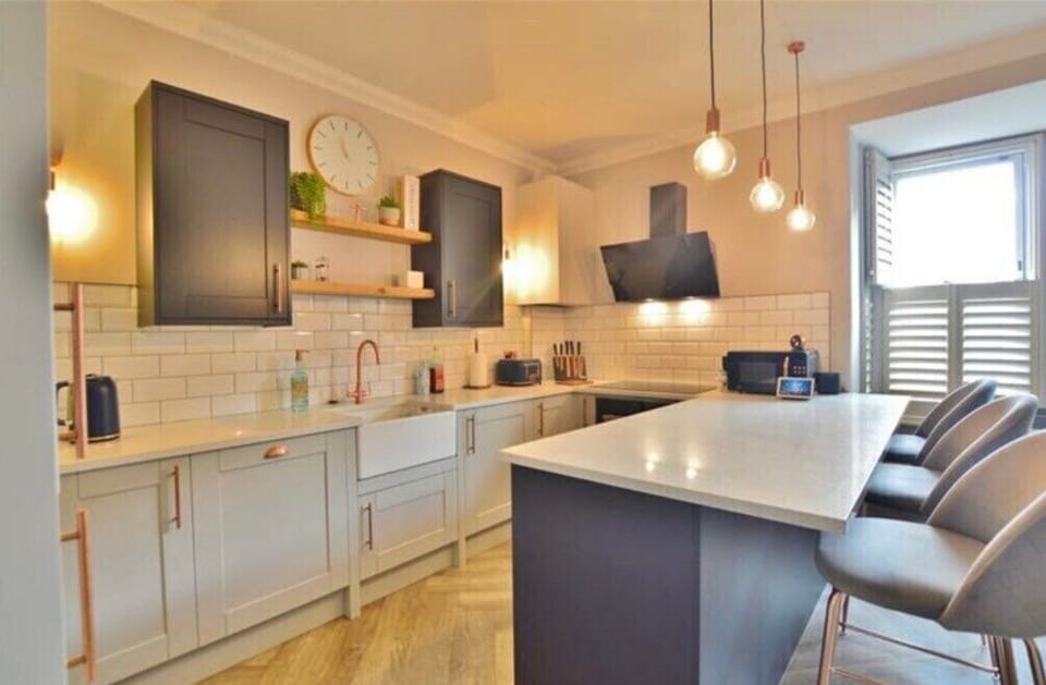 Kitchen area, electric over & hob, microwave, fridge freezer, dishwasher, kettle & toaster.