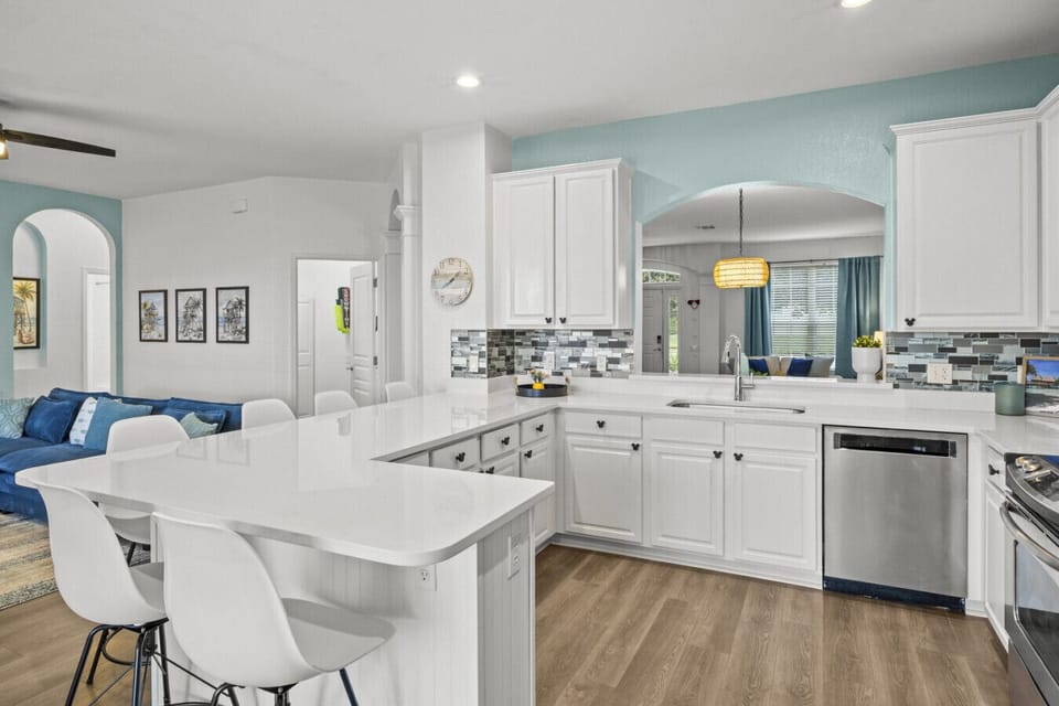 Open-concept layout connecting kitchen, dining, and living spaces for easy group living.