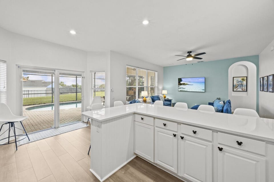 Spacious open-concept living area with seamless flow between kitchen and lounge spaces.