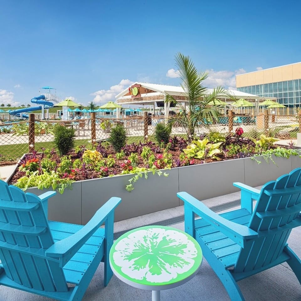 Sip morning coffee on the balcony above tropical landscaping.
