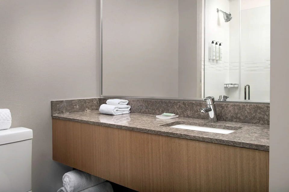 Start your day at the spacious vanity with bright mirror lighting.