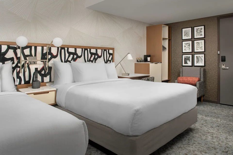 Settle in for a restful night with plush pillows and warm lighting.