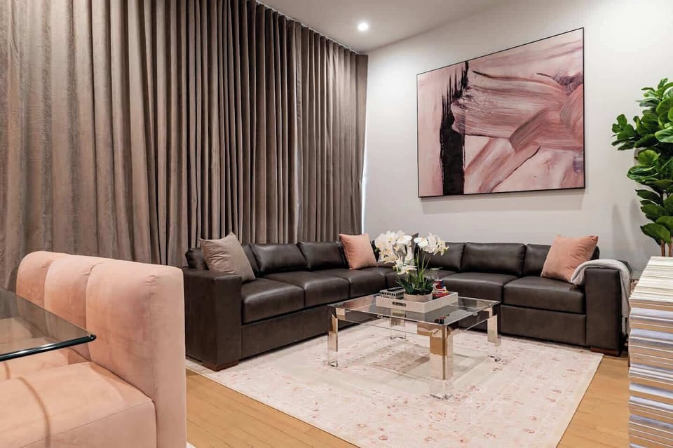 Living / Dining Area. Table dining for eight, counter dining for four, and queen-size sleeper sofa.