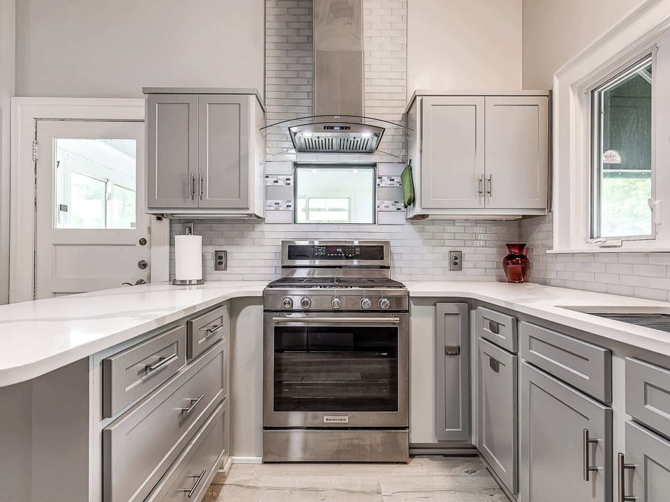 Our bright and spacious kitchen is a chef's dream, featuring sleek stainless steel appliances, a modern island, and beautiful hardwood floors. It's fully equipped to handle all your culinary needs.