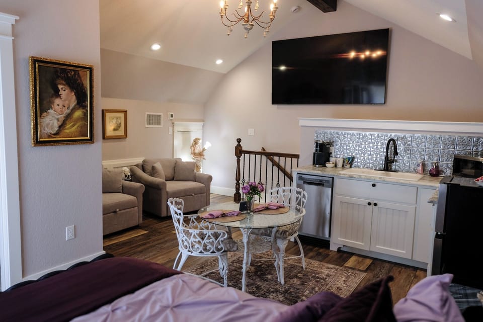 Charming loft studio with kitchenette, dining nook, and large TV