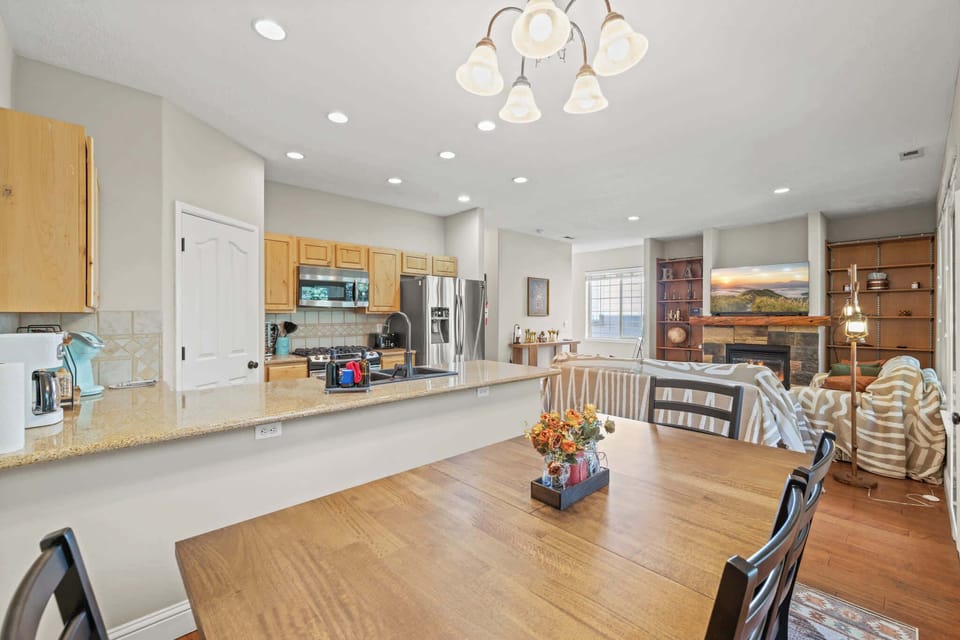Another angle of the kitchen with modern amenities and a welcoming feel.