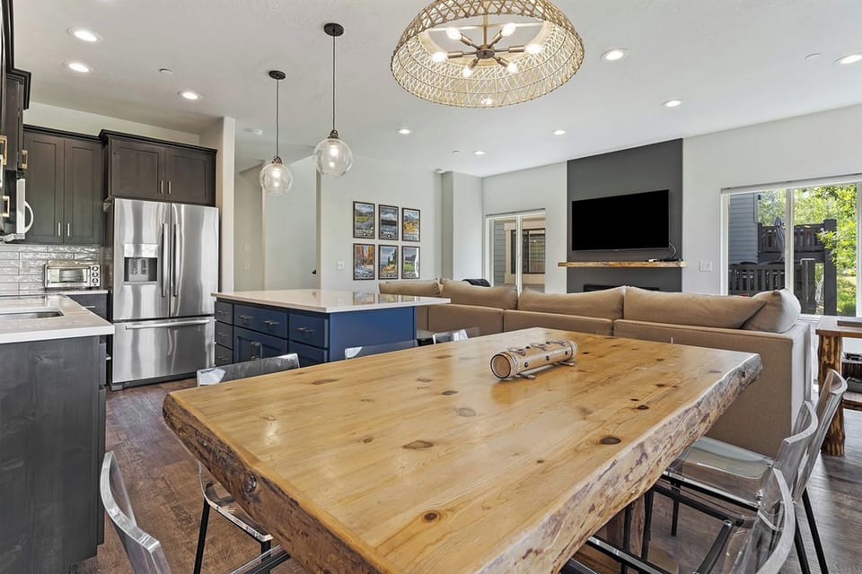 An airy, sophisticated dining space flows effortlessly into the kitchen and living areas, creating a refined atmosphere for entertaining.
