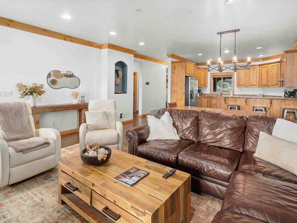 Inviting living space designed for gathering, with seamless flow into the kitchen and dining area.