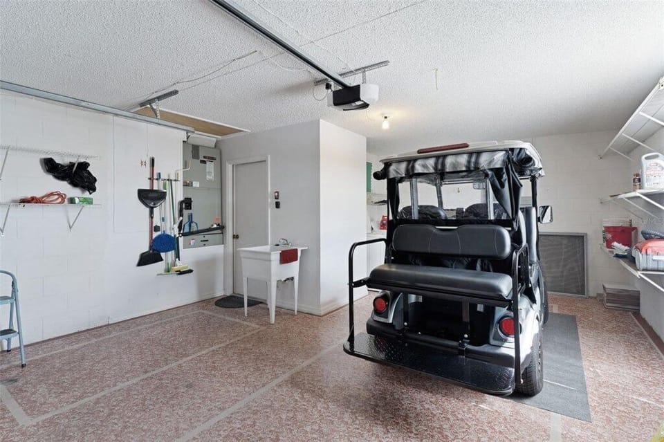 Back of golf cart and garage.