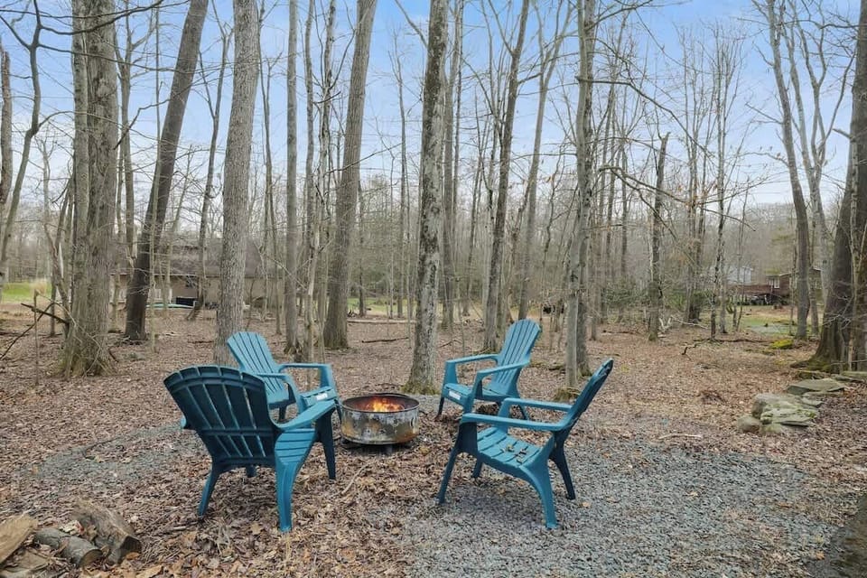 Unwind around the fire pit amid tranquil forest views and fresh air!