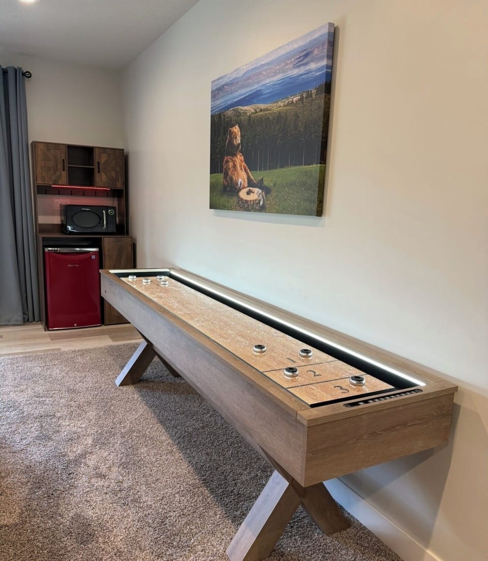 Shuffle board table, beverage fridge & microwave in Recreation Room