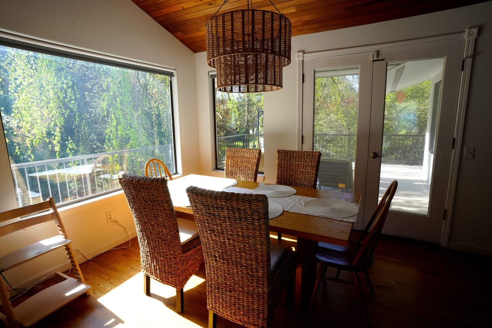 Located upstairs. Table with 6 chairs. Easy access to outdoor deck