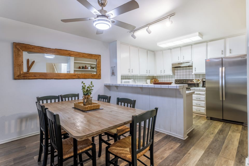 Dining room table opens to kitchen.