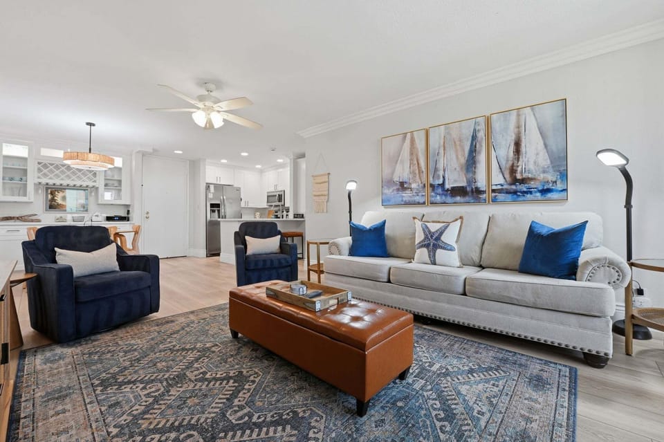 An inviting, elevated living area where coastal décor and natural light create a perfect sanctuary after a day in the sun.