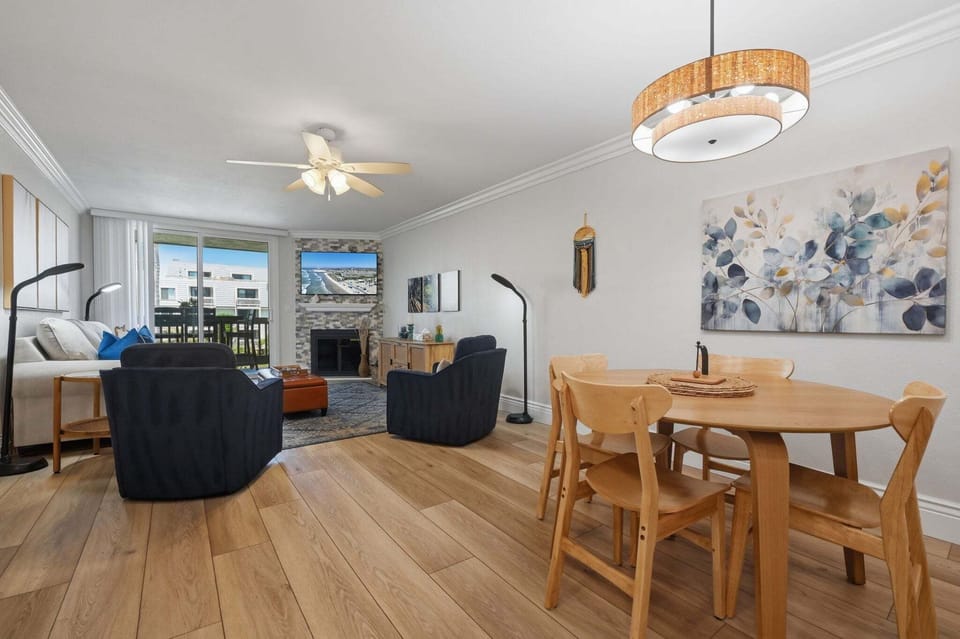 Gather around the round dining table for four, illuminated by modern lighting—the ultimate spot for games and late-night chats.