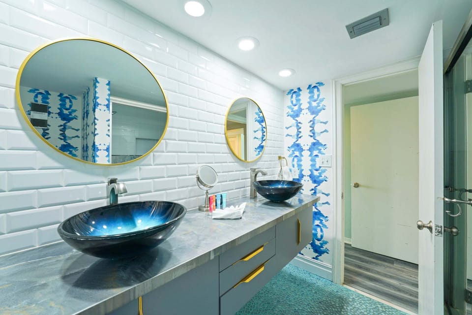 Experience comfort and style in this renovated bathroom with a spacious walk in shower, designer fixtures, and elegant finishes perfect for your Destin beach vacation.