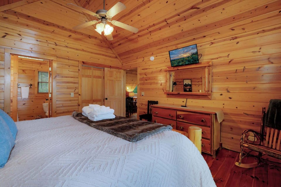 The primary king suite boasts a balcony, smart TV, & an ensuite bath​