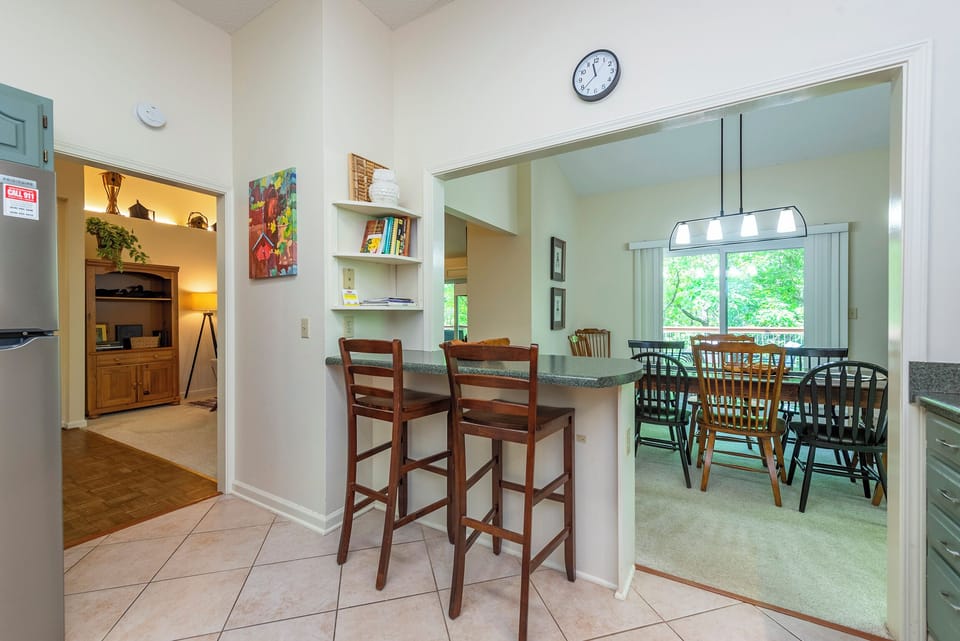 Bar seats in the kitchen for extra space.