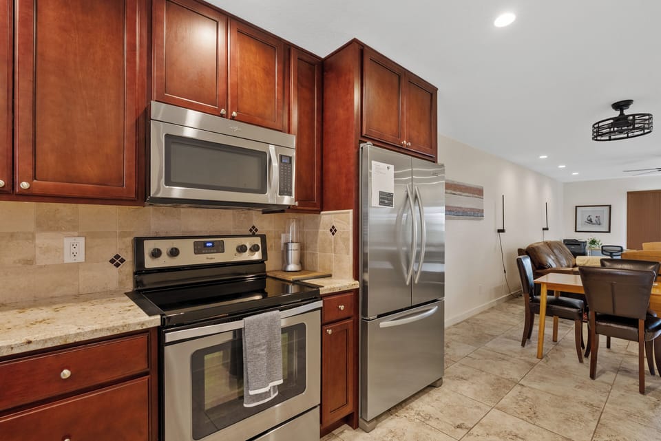 Fully equipped kitchen with stainless steel appliances, ample counter space, and everything needed for everyday cooking.