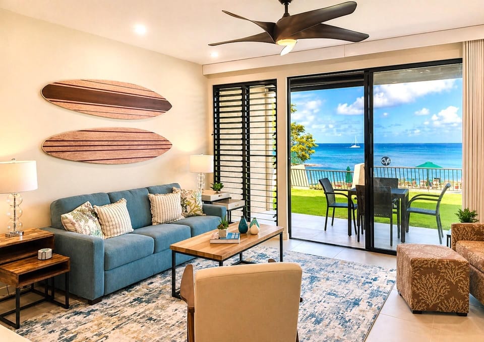 Open living area with ocean views and direct access to the lanai beyond