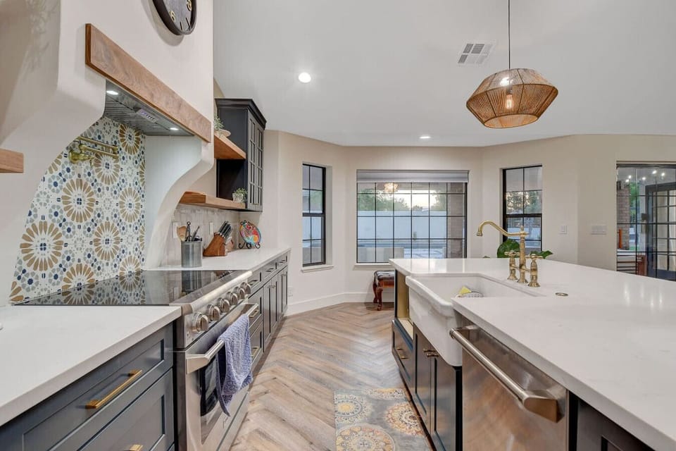 Fully equipped kitchen with modern appliances, cookware, and a spacious layout, perfect for whipping up meals or enjoying morning coffee