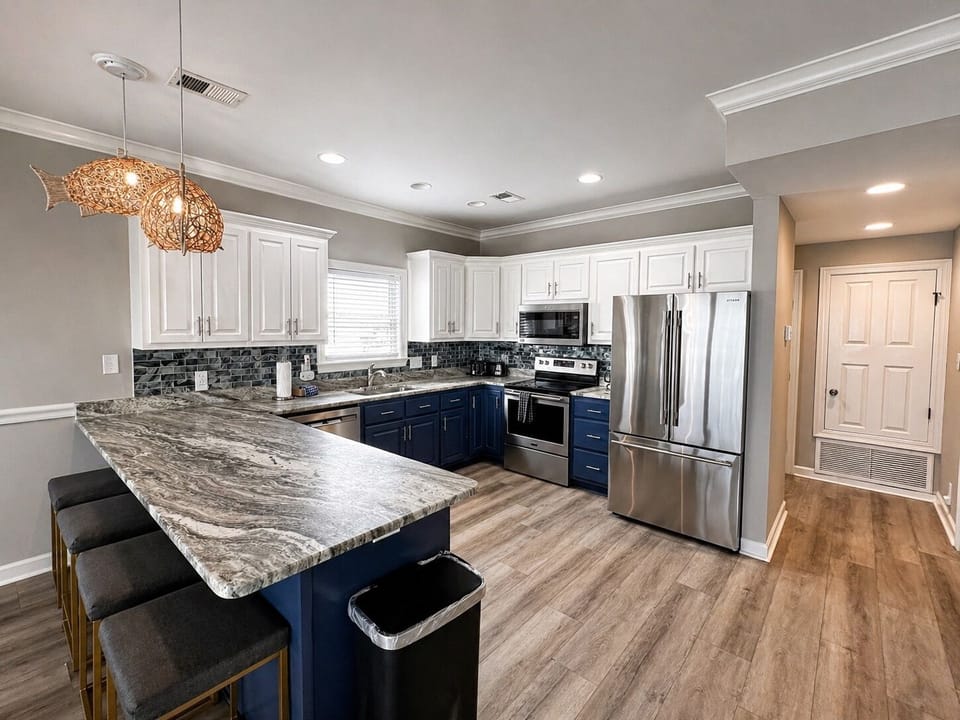 The kitchen offers stainless appliances, two refrigerators and is fully equipped for all of your cooking needs
