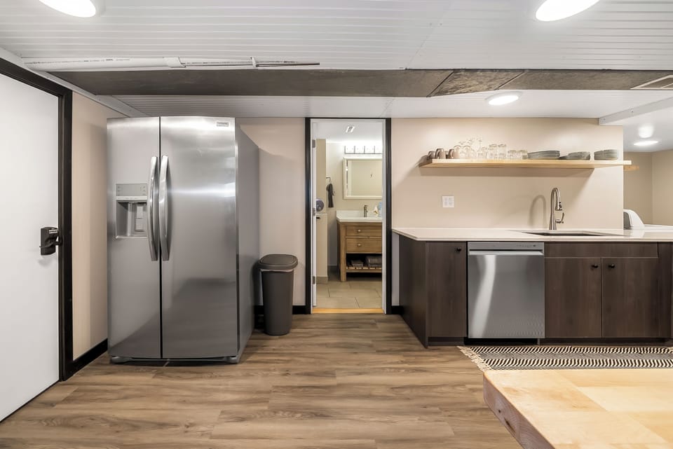Your fully equipped kitchen features stainless steel appliances and sleek countertops, perfect for preparing meals during your stay.