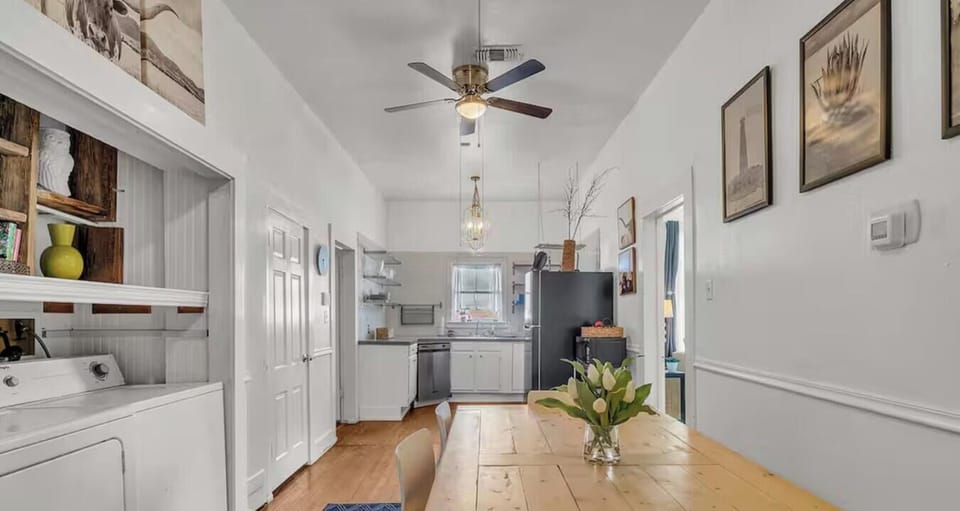 The dining room flows seamlessly into the kitchen and laundry nook, keeping the whole home connected.