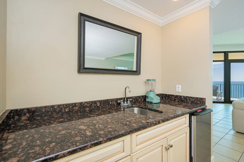Whip up refreshing smoothies at your stylish wet bar, perfect for enjoying while unwinding with loved ones