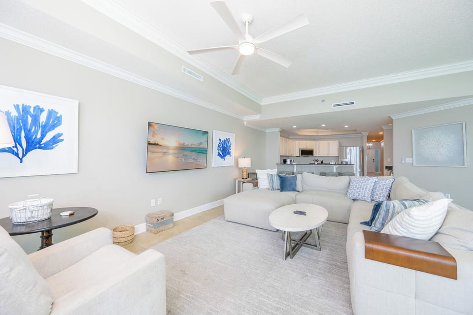 Relax on soft seating while enjoying family movie nights, with vibrant decor capturing the beachside vibe