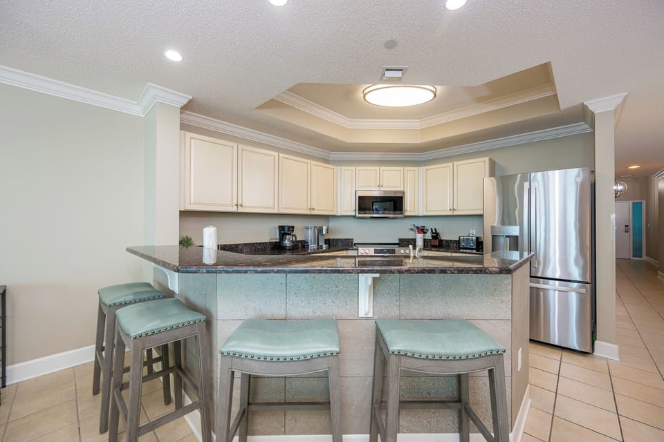 Sink into the stylish bar seating to enjoy morning coffee while planning your beachside adventures ahead