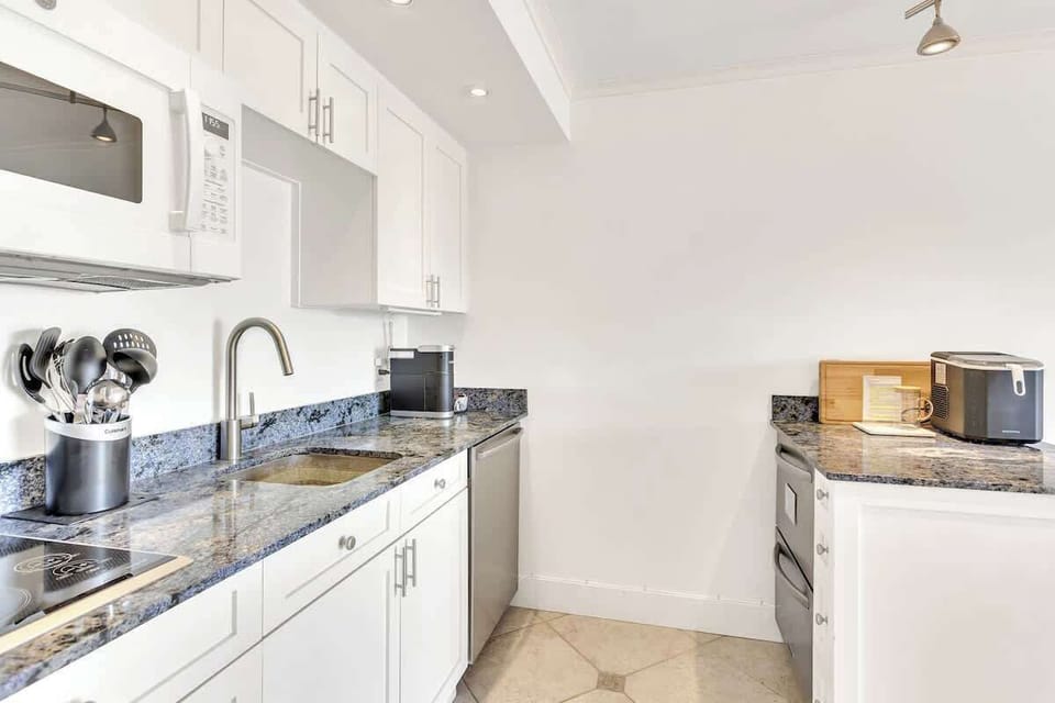 Your fully equipped kitchen features granite countertops, modern appliances, and everything you need to prepare meals during your stay.
