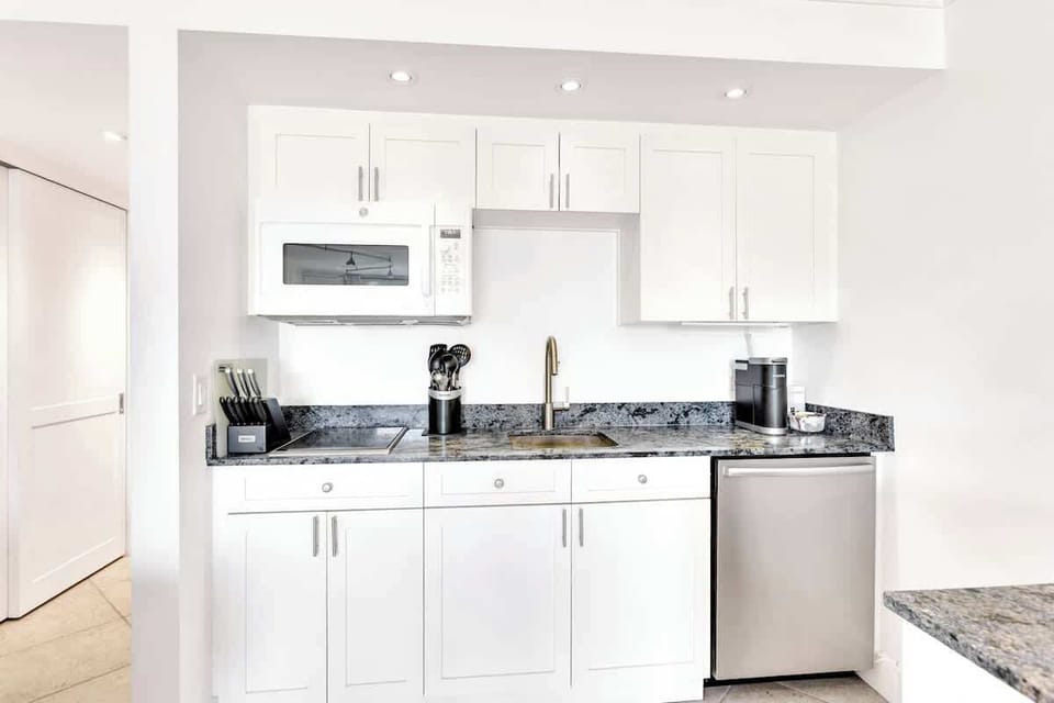 Your sleek kitchen features granite countertops, stainless steel appliances, and everything you need to prepare meals during your stay.