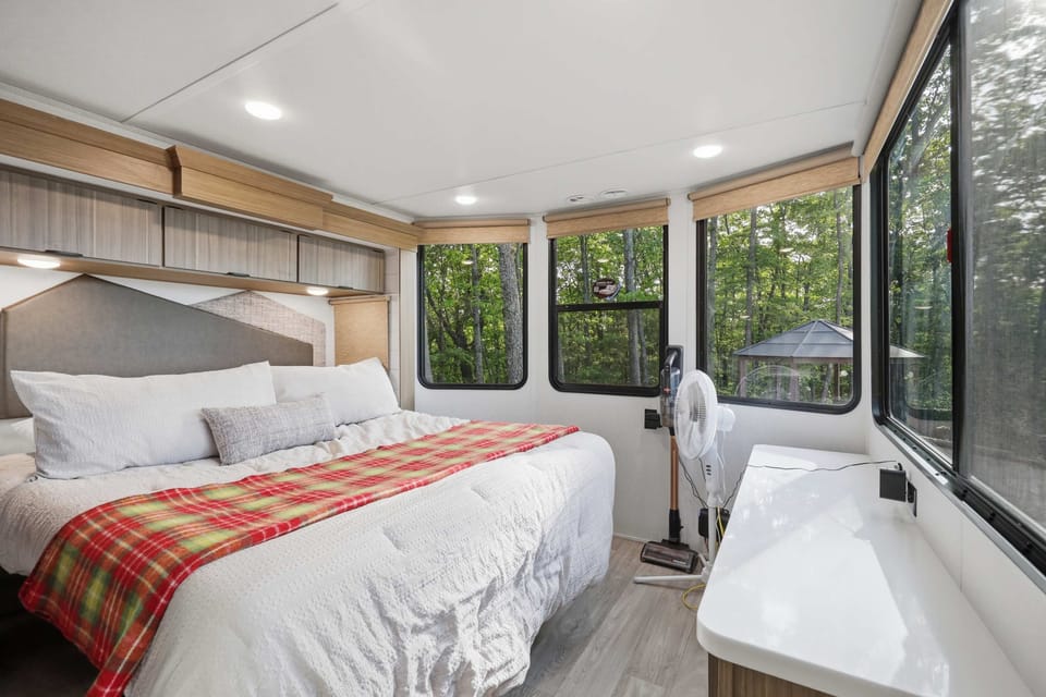 Master BR with tilt up queen bed and electric fireplace. 