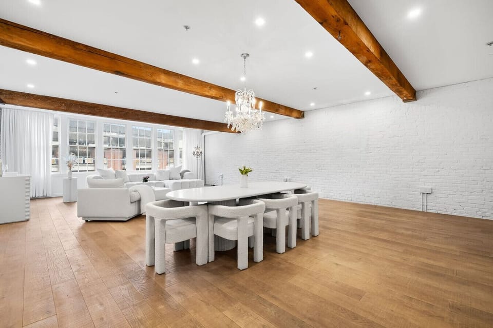 Spacious, sophisticated, and filled with natural light. This stunning open-concept loft features elegant dining, luxurious living spaces, and timeless architectural charm.
