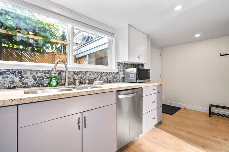 Bright kitchen with double sink and plenty of counter space.